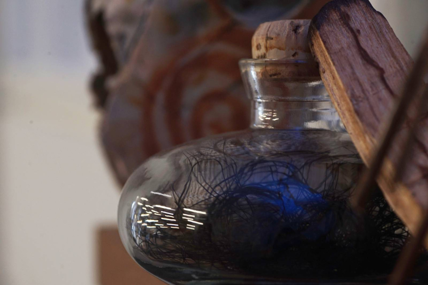 Witch bottle inspired, glass, feathers, horse hair (detail)