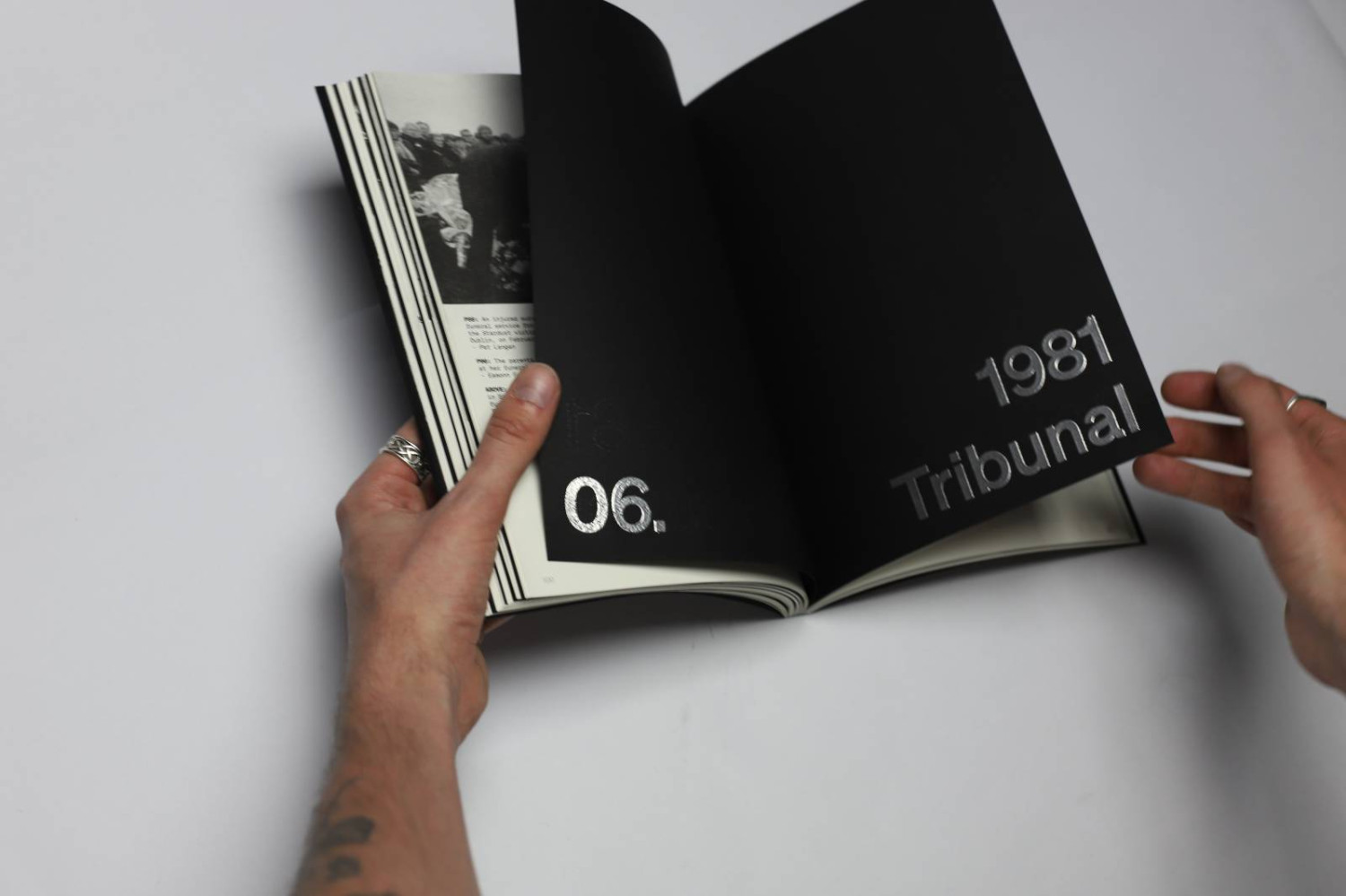 Publication with 8 chapter and interlude pages on 115gsm Ultra Black Sirio paper with silver embossed type.