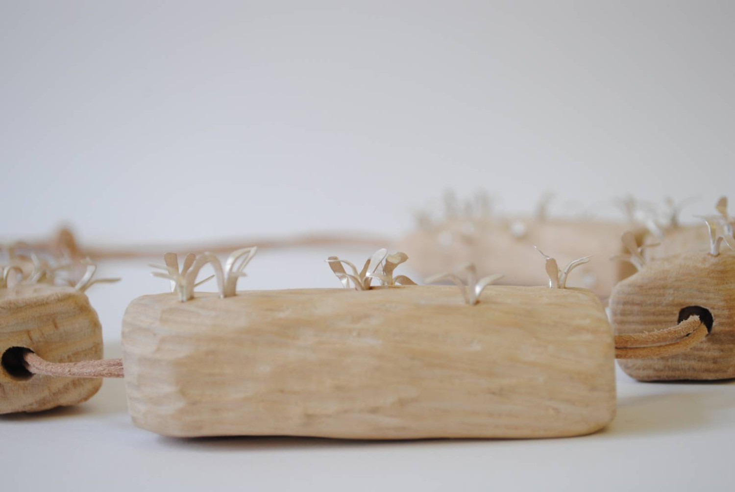 *The Bark that Blooms*, neckpiece. Wood (ash), sterling silver, leather cord (detail)