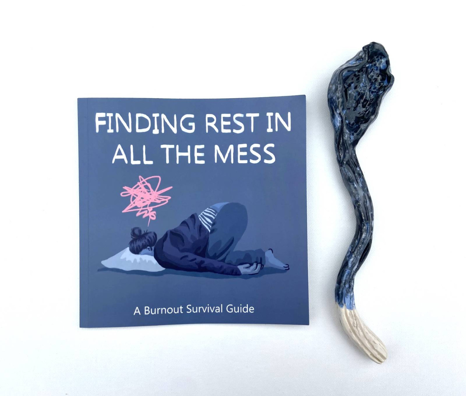 *Finding Rest in all the Mess, A Burnout Survival Guide*, book with a piece from the *Spoon Theory* ceramic  sculpture
