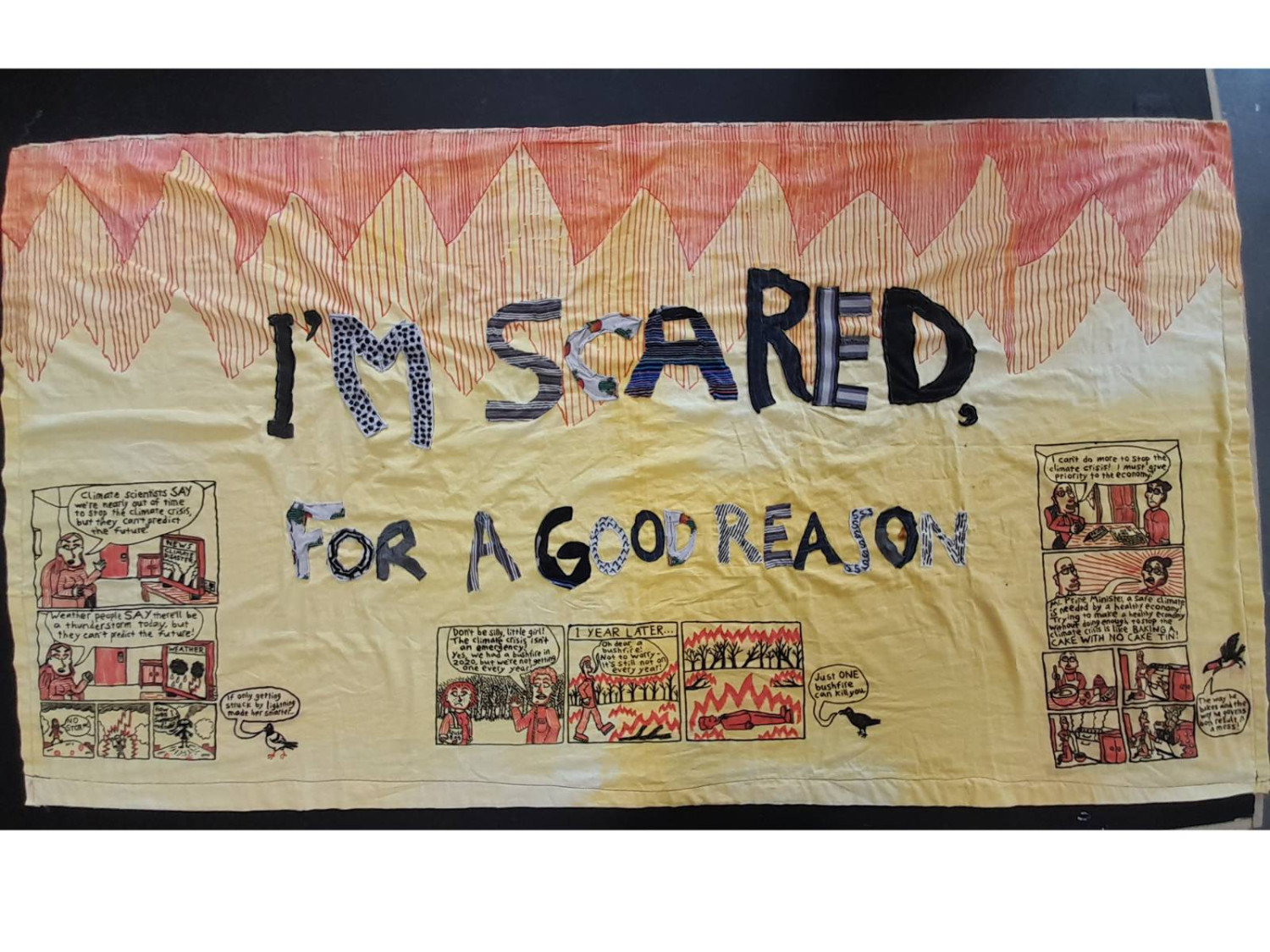 *I'm Scared for a Good Reason*, banner made of old duvet cover and old clothing